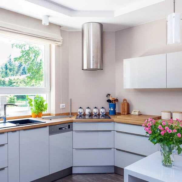 Kitchen counter with fresh flowers, kept spotless by a regular cleaning visit